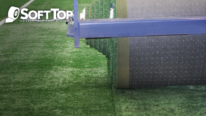 The SoftTop Convertible Turf System being rolled up at the AT&T Stadium in Arlington, TX.